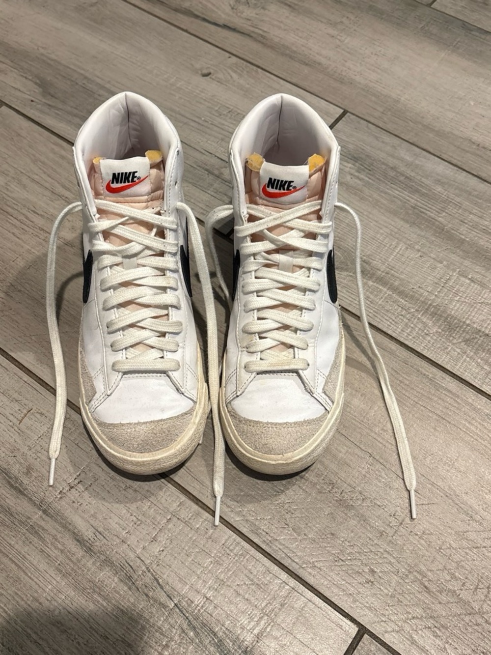 Nike White High-Top Sneakers with Black Swoosh and Cream Accents
